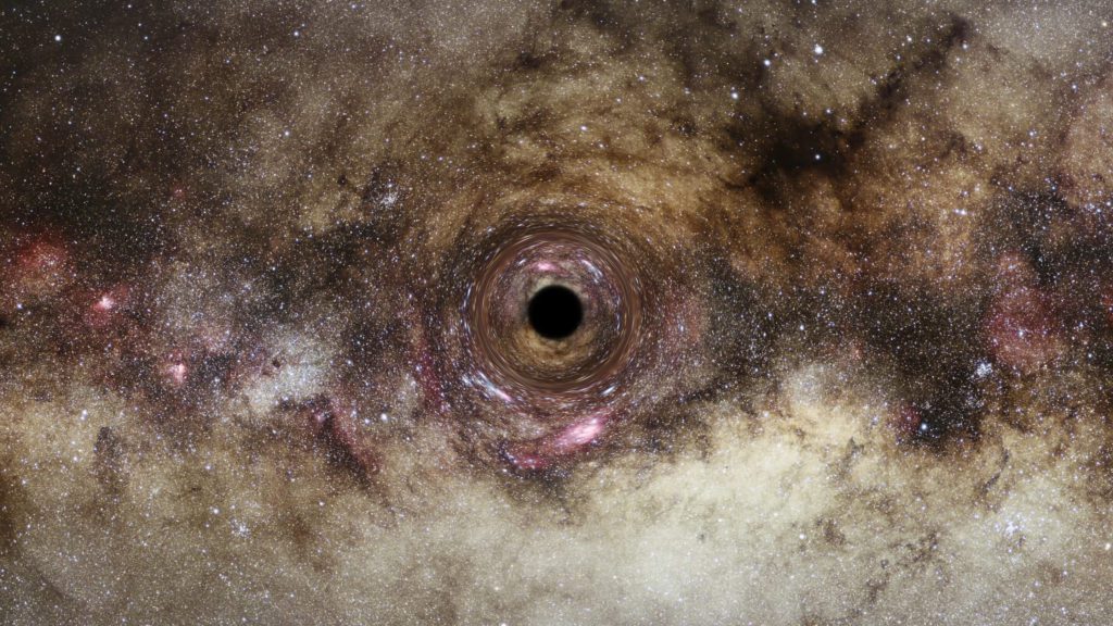 Zwaartekracht-lichtbuiging onthult een van de grootste zwarte gaten die ooit zijn ontdekt
