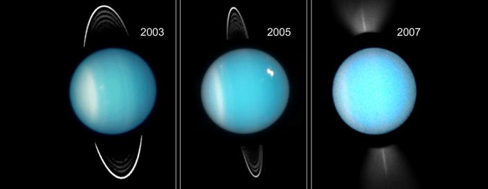 Drie afbeeldingen naast elkaar tonen verschillende weergaven van de ringen zoals gezien door Hubble.  Deze zijn vaag op de foto's.