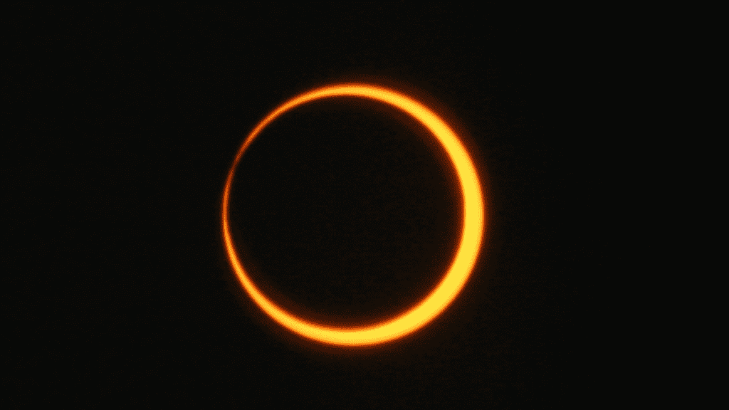 the sun appears as a gold ring in the sky, which is blacked out by solar filters