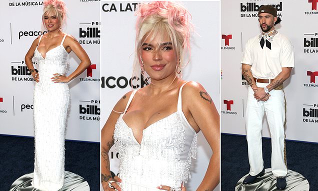 Karol G draagt ​​een witte jurk met pailletten en Bad Bunny poseert in Gucci terwijl ze op de rode loper springt tijdens de Billboard Latin Music Awards 2023